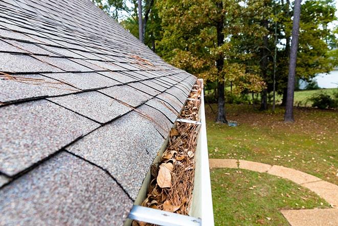 maintenance work on a home's rain gutter system